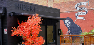 Orange street art wall beside refined Japanese restaurant facade_Tony Elsom