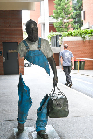 'Raphael, the Traveller' statue by artist Bruno Catalano in Fish Lane.