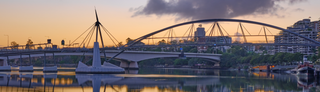 Sunset over Brisbane's inner city pedestrian bridges.